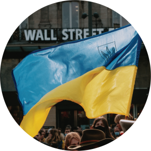 A group waving a Ukrainian flag in the street